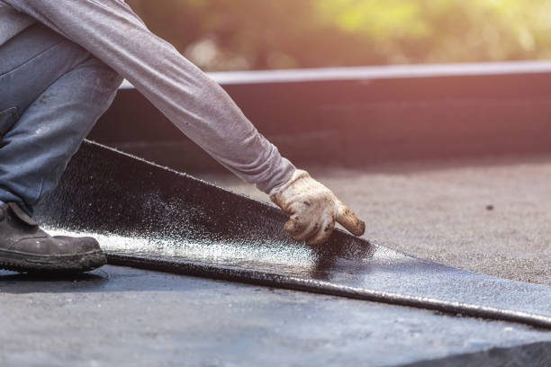 Professional Exterior Waterproofing technician working in East Bethany, NY